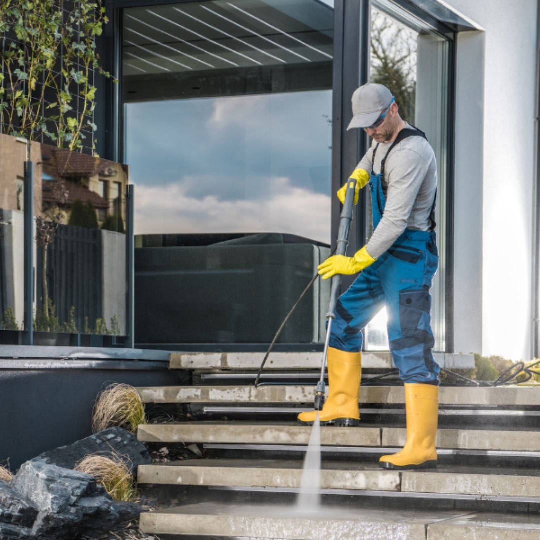 Commercial outdoor space being professionally pressure cleaned for a fresh finish