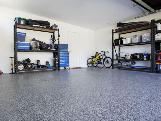 Slip-resistant coated basement floor designed to reduce moisture and dust