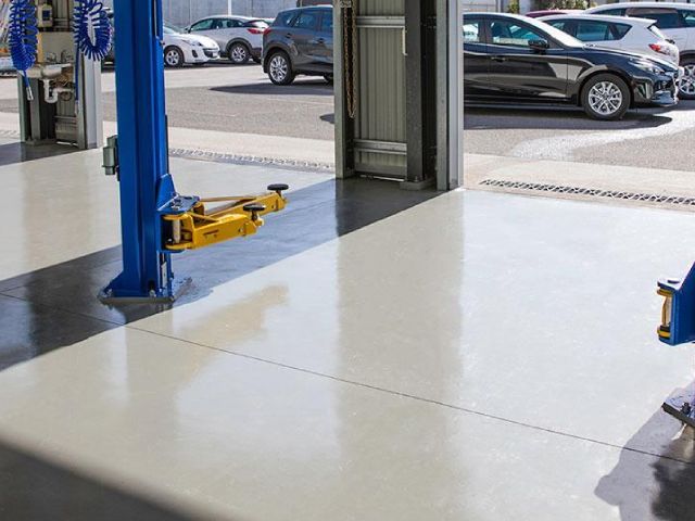 Industrial concrete coating in a car park or loading bay with colour-coded zones