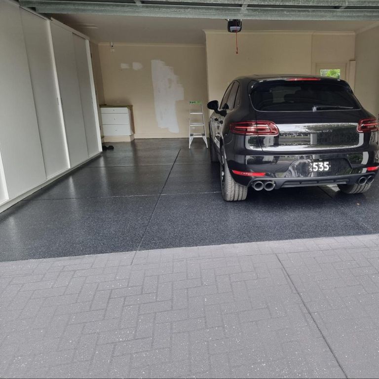 Epoxy flake garage floor in a high-end residential or commercial garage