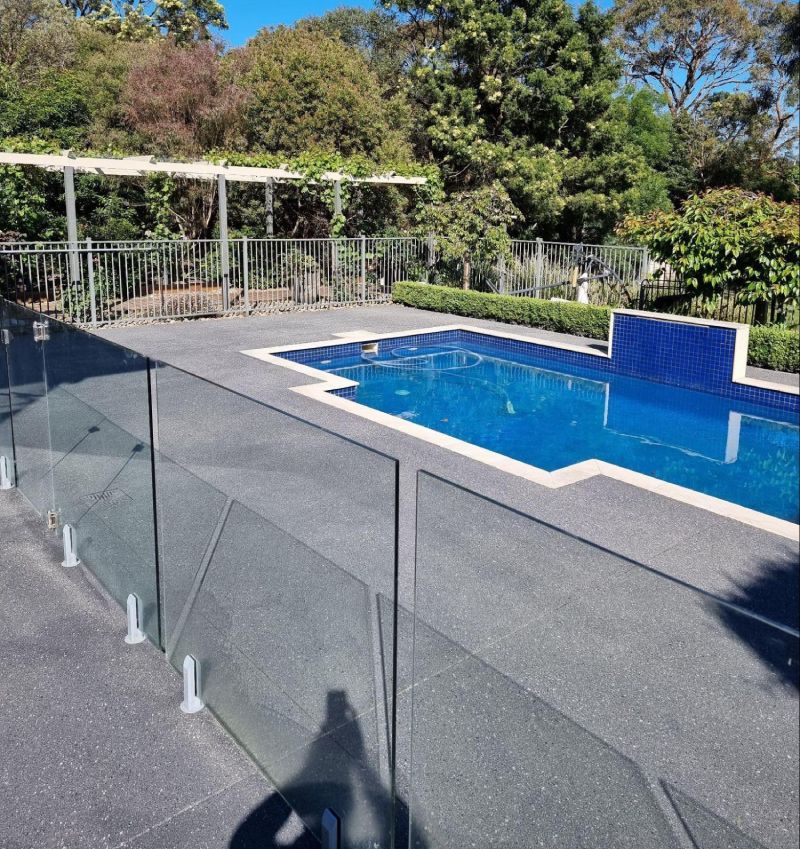 Grey permeable paving installed around a pool area in Melbourne, providing slip resistance and effective drainage.
