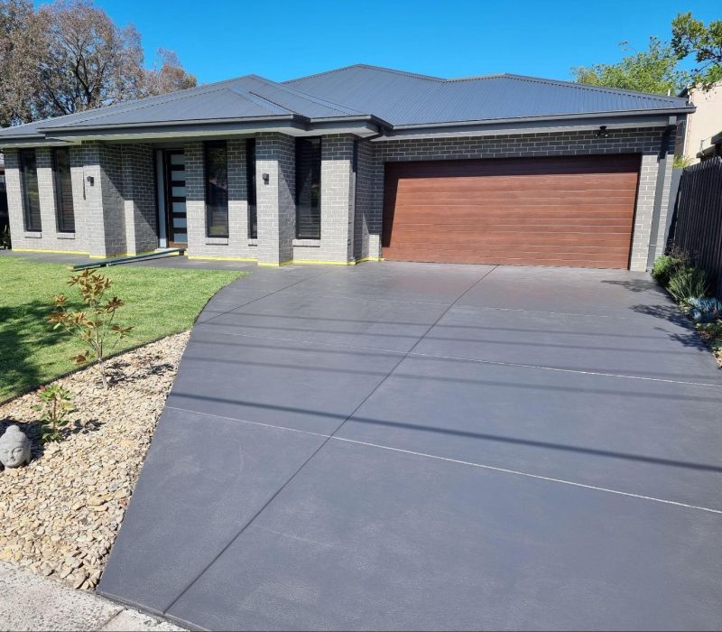 Durable sealed concrete service bay in Melbourne designed to resist stains, chemicals, and heavy use