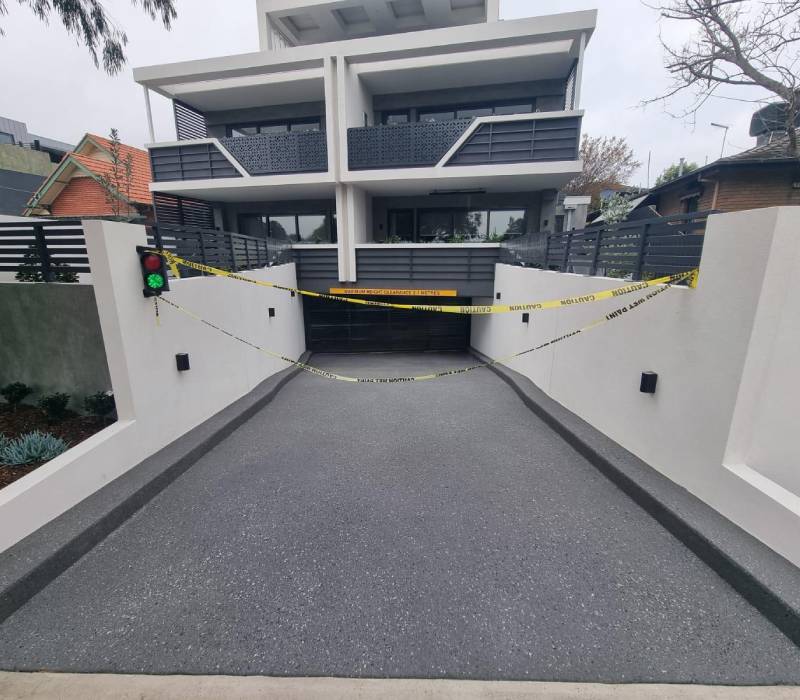 Resurfaced exposed aggregate concrete driveway.