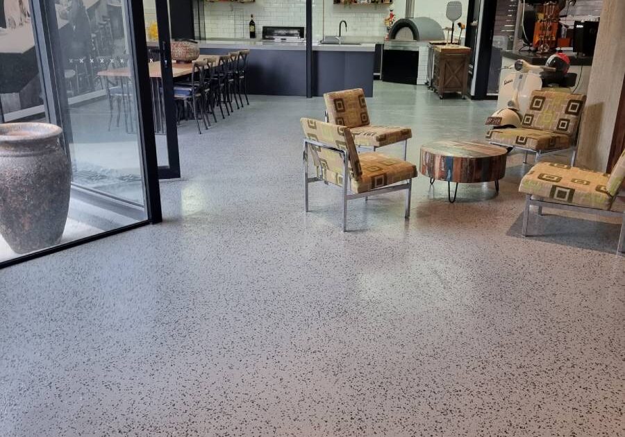 Decorative flake finish interior concrete flooring in a modern home