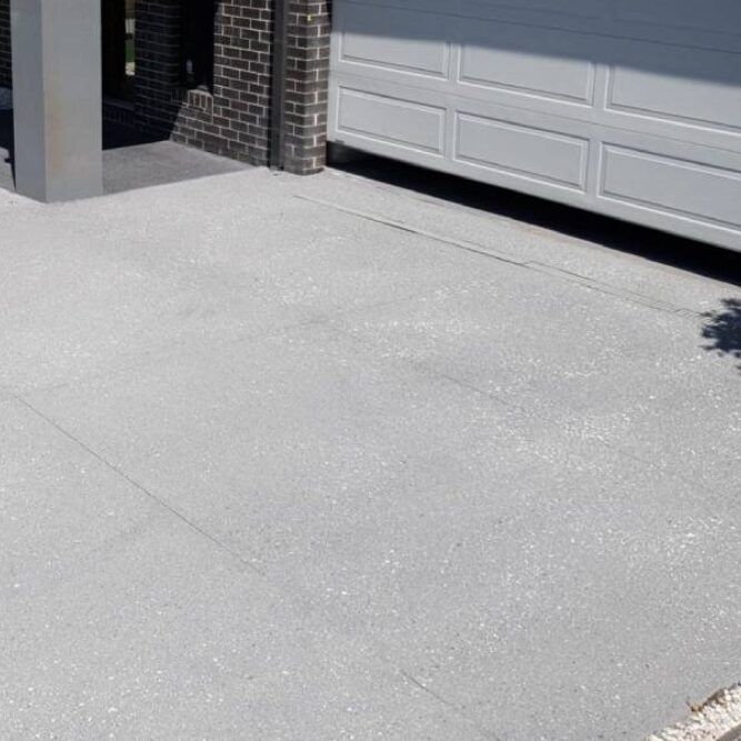 Grey concrete driveways along a Narre Warren street