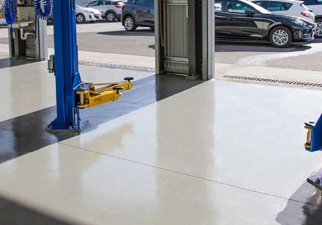 Industrial concrete coating in a car park or loading bay with colour-coded zones