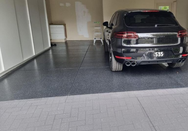 Epoxy flake garage floor in a high-end residential or commercial garage